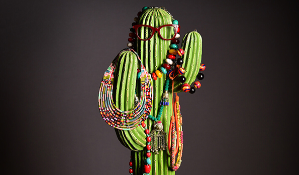 A selection of necklaces arranged on a cactus