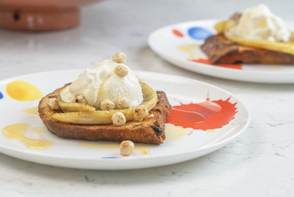 Bananas and Ice cream with brandy syrup on panettone